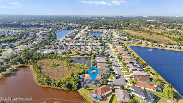 aerial perspective of suburban area with a large body of water