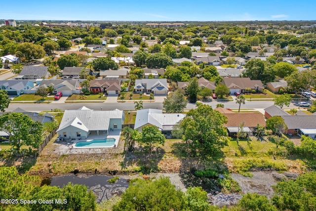 aerial view of residential area featuring a pool