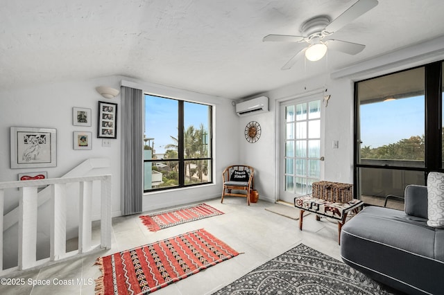 8 Cove Rd Unit 8-B, Melbourne Beach, FL 32951 - tiled living room with a wall unit AC, a ceiling fan, and a textured ceiling