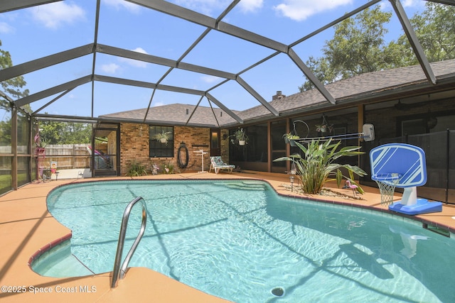 pool with a patio and a lanai