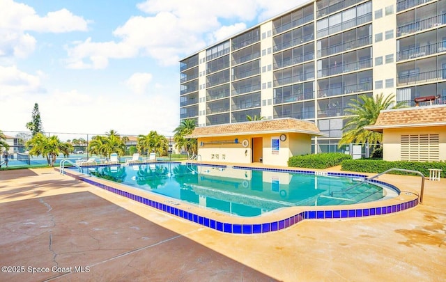 community pool with a patio