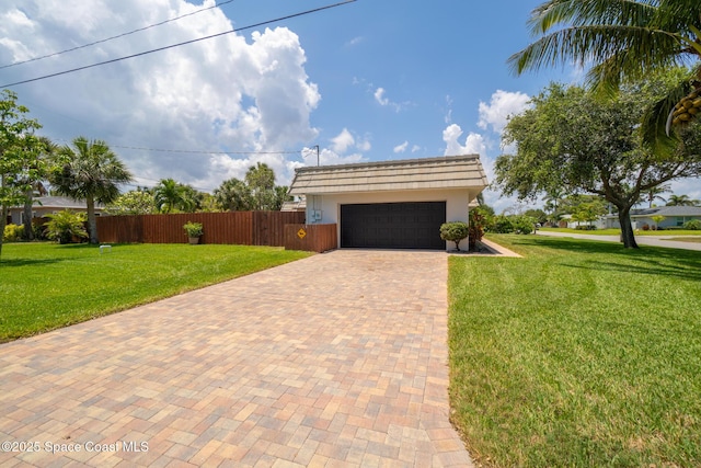 view of front of property featuring decorative driveway, stucco siding, and a garage