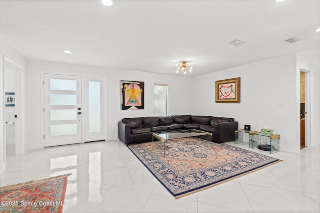 living room with recessed lighting, baseboards, and light tile patterned floors