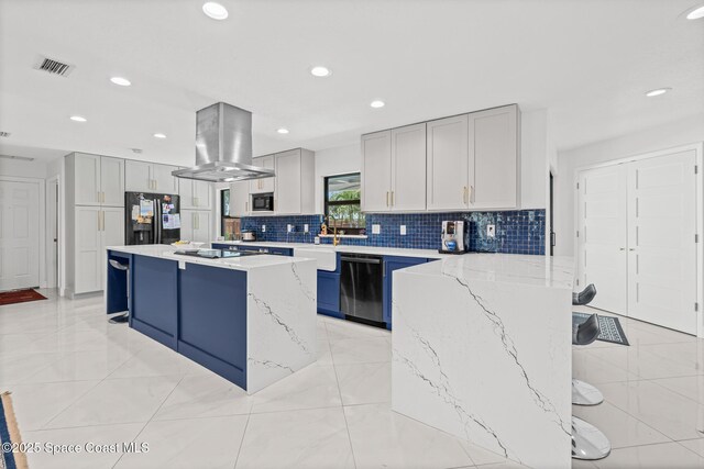 kitchen with black appliances, island exhaust hood, decorative backsplash, a kitchen bar, and recessed lighting