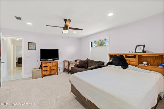 bedroom featuring light carpet, ceiling fan, recessed lighting, and baseboards