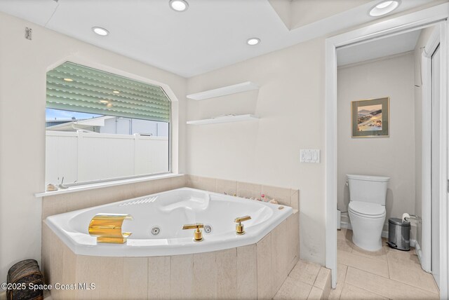 bathroom featuring a whirlpool tub, toilet, tile patterned floors, and recessed lighting