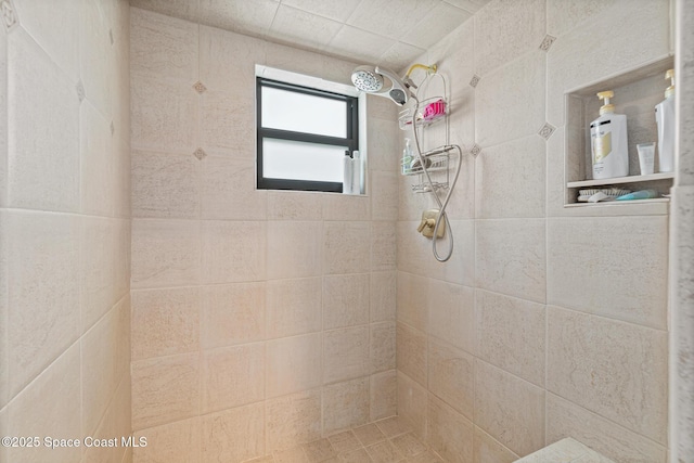 full bathroom featuring a tile shower