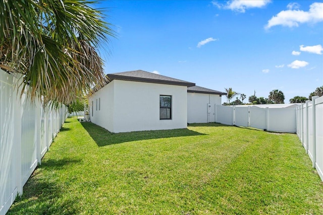 view of yard with a fenced backyard