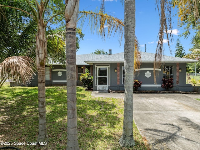 1554 Nona St NE, Palm Bay, FL 32907 - single story home with roof with shingles and a front yard