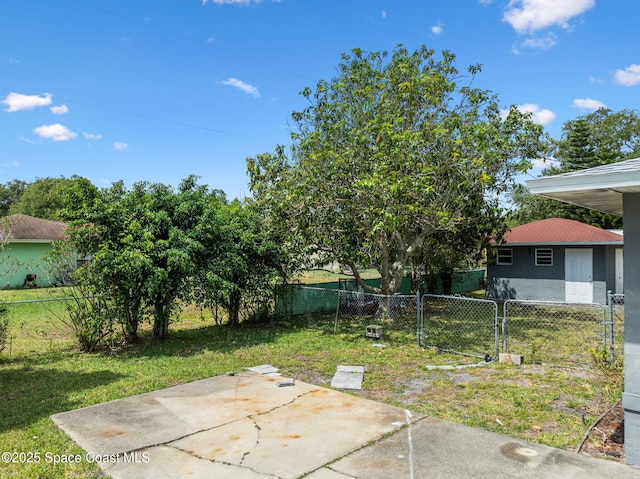 1554 Nona St NE, Palm Bay, FL 32907 - view of yard with a patio and a gate