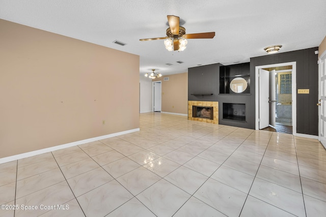 1554 Nona St NE, Palm Bay, FL 32907 - unfurnished living room featuring ceiling fan, a tiled fireplace, light tile patterned floors, and baseboards