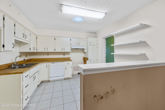 1554 Nona St NE, Palm Bay, FL 32907 - kitchen with dishwasher, a sink, a textured ceiling, a peninsula, and white cabinets