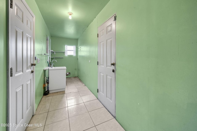 1554 Nona St NE, Palm Bay, FL 32907 - laundry area featuring light tile patterned floors
