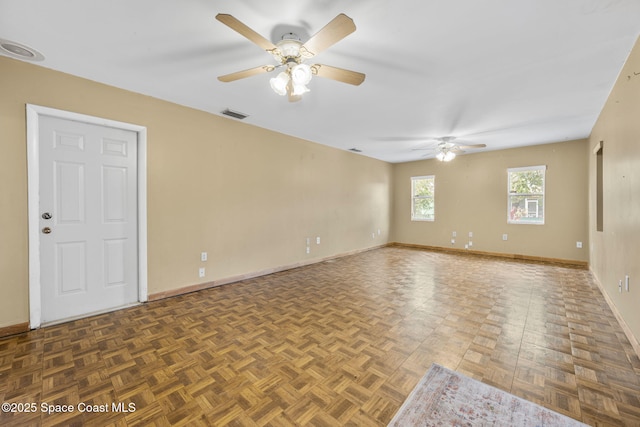 1554 Nona St NE, Palm Bay, FL 32907 - unfurnished room featuring a ceiling fan and baseboards