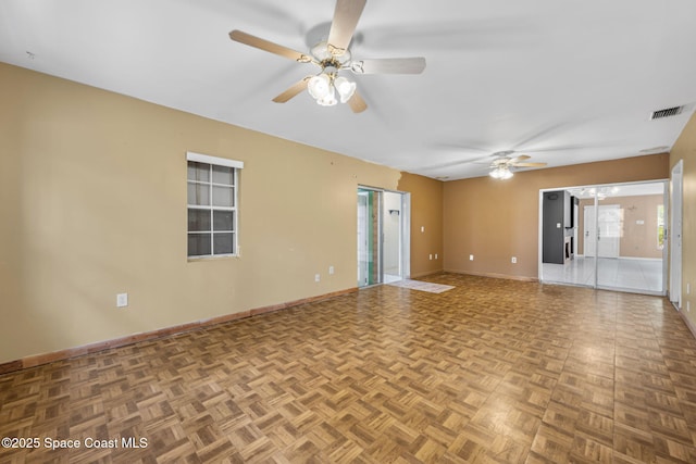 1554 Nona St NE, Palm Bay, FL 32907 - unfurnished room featuring a ceiling fan and baseboards
