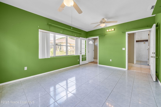1554 Nona St NE, Palm Bay, FL 32907 - unfurnished bedroom with tile patterned floors, baseboards, french doors, and ceiling fan