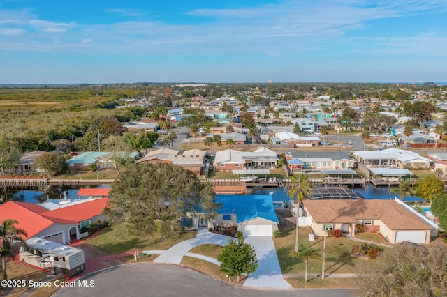 aerial view featuring a water view and a residential view