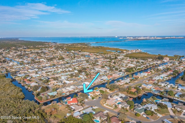 bird's eye view featuring a water view and a residential view