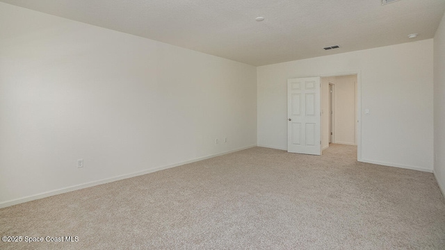 1276 Dugan Cir SE, Palm Bay, FL 32909 - empty room with baseboards, visible vents, and light colored carpet
