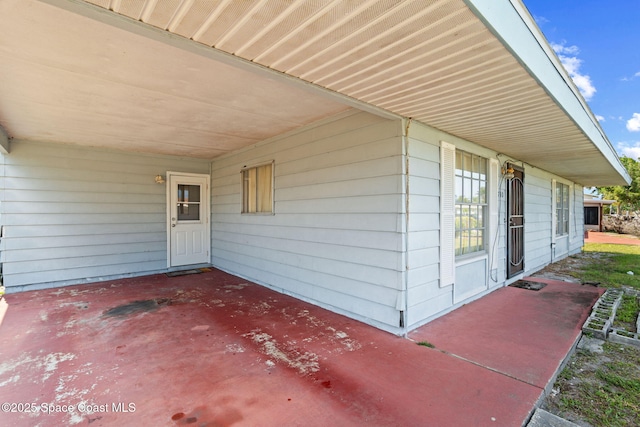 view of patio featuring a carport