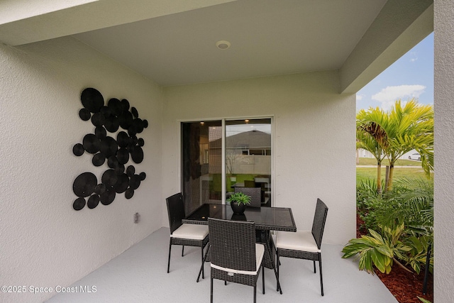view of patio featuring outdoor dining area