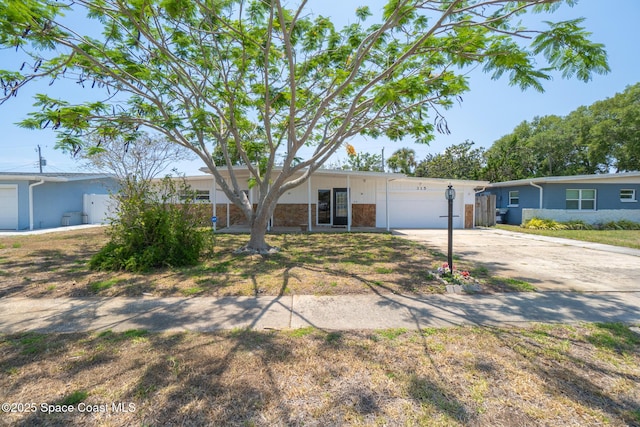 315 Cherry Ave, Merritt Island, FL 32953 - ranch-style house featuring driveway and a garage