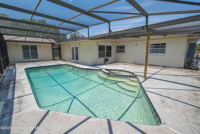 315 Cherry Ave, Merritt Island, FL 32953 - view of swimming pool featuring a patio, a pool with connected hot tub, and glass enclosure
