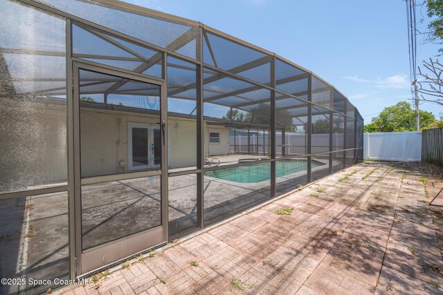 315 Cherry Ave, Merritt Island, FL 32953 - view of swimming pool featuring a fenced backyard, a patio area, a lanai, and french doors