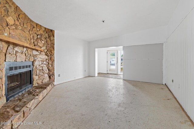315 Cherry Ave, Merritt Island, FL 32953 - unfurnished living room featuring a stone fireplace and heating unit