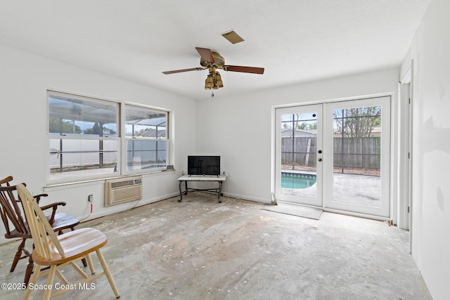 315 Cherry Ave, Merritt Island, FL 32953 - sitting room with a wall mounted AC, french doors, and a ceiling fan