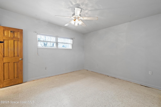 315 Cherry Ave, Merritt Island, FL 32953 - spare room with speckle patterned floor, a ceiling fan, and baseboards