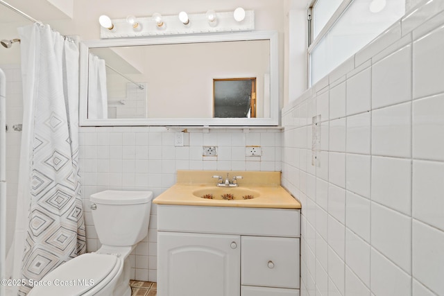 315 Cherry Ave, Merritt Island, FL 32953 - full bath with tile walls, toilet, vanity, and curtained shower