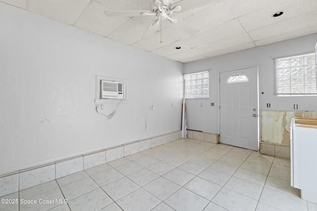 315 Cherry Ave, Merritt Island, FL 32953 - entrance foyer with light tile patterned flooring, ceiling fan, and a drop ceiling