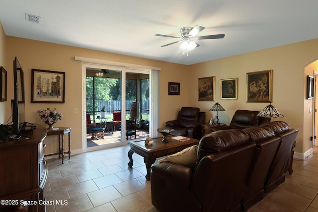 249 Franzing St, Palm Bay, FL 32908 - tiled living area featuring ceiling fan, arched walkways, and baseboards