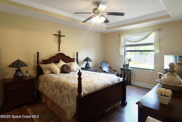 249 Franzing St, Palm Bay, FL 32908 - bedroom featuring dark wood-type flooring, a raised ceiling, ornamental molding, baseboards, and a ceiling fan