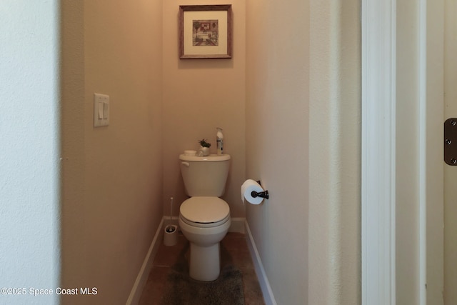 249 Franzing St, Palm Bay, FL 32908 - bathroom featuring toilet, tile patterned floors, and baseboards