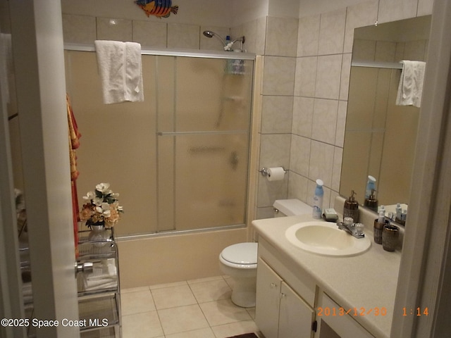 1412 Napanee St NW, Palm Bay, FL 32907 - full bath featuring enclosed tub / shower combo, vanity, toilet, and tile patterned floors