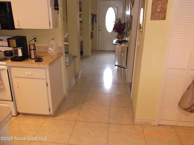 1412 Napanee St NW, Palm Bay, FL 32907 - corridor featuring baseboards and light tile patterned flooring