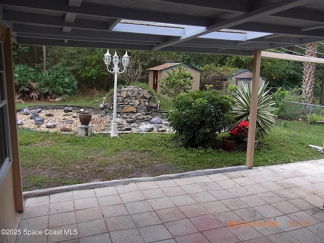 1412 Napanee St NW, Palm Bay, FL 32907 - view of patio with fence, an outdoor structure, and a shed