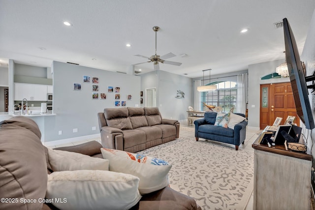 4220 Savannahs Trl, Merritt Island, FL 32953 - living room featuring ceiling fan, recessed lighting, baseboards, and light tile patterned floors