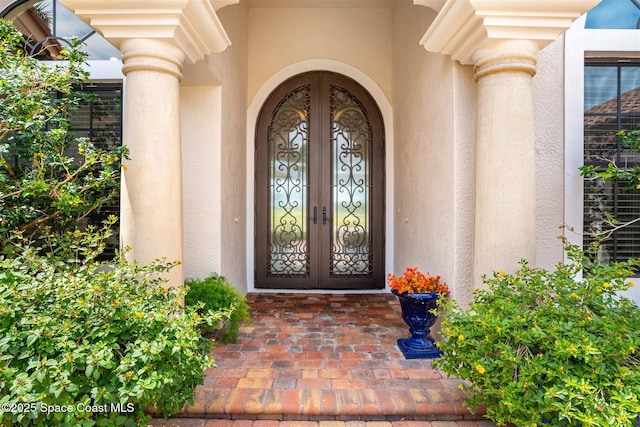 7346 Gorda Peak Ct, Melbourne, FL 32940 - entrance to property featuring stucco siding and french doors