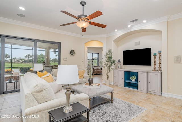7346 Gorda Peak Ct, Melbourne, FL 32940 - living area featuring ornamental molding, arched walkways, a ceiling fan, baseboards, and recessed lighting