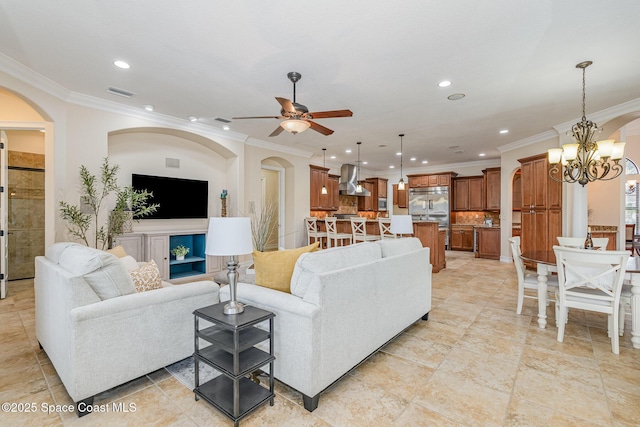 7346 Gorda Peak Ct, Melbourne, FL 32940 - living area with ornamental molding, recessed lighting, ceiling fan, a chandelier, and arched walkways
