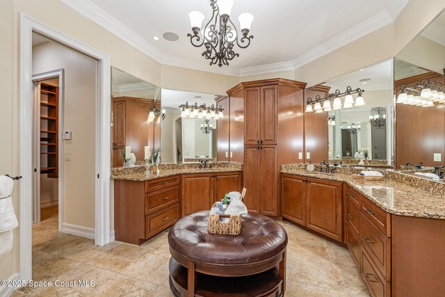 7346 Gorda Peak Ct, Melbourne, FL 32940 - bathroom with a chandelier, crown molding, and two vanities