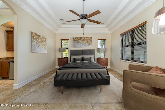 7346 Gorda Peak Ct, Melbourne, FL 32940 - bedroom featuring a tray ceiling, crown molding, baseboards, arched walkways, and connected bathroom