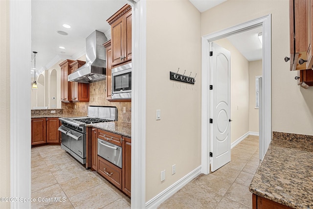 7346 Gorda Peak Ct, Melbourne, FL 32940 - kitchen with wall chimney exhaust hood, appliances with stainless steel finishes, a warming drawer, tasteful backsplash, and brown cabinets