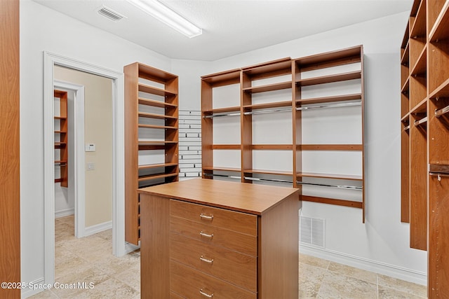 7346 Gorda Peak Ct, Melbourne, FL 32940 - walk in closet with light tile patterned flooring