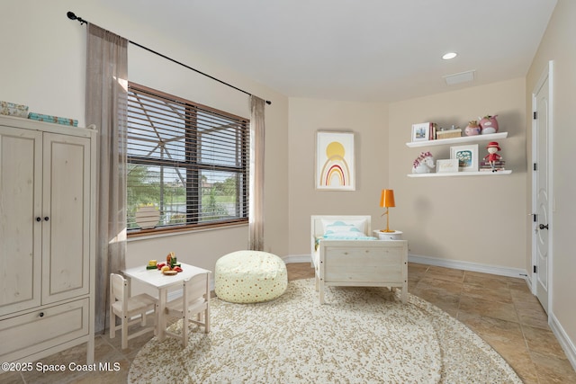 7346 Gorda Peak Ct, Melbourne, FL 32940 - sitting room featuring baseboards and light stone finish flooring