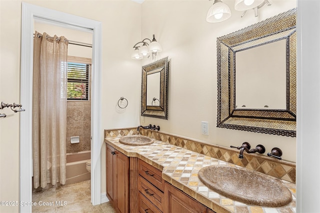 7346 Gorda Peak Ct, Melbourne, FL 32940 - bathroom with double vanity, toilet, tile patterned flooring, and shower / tub combo