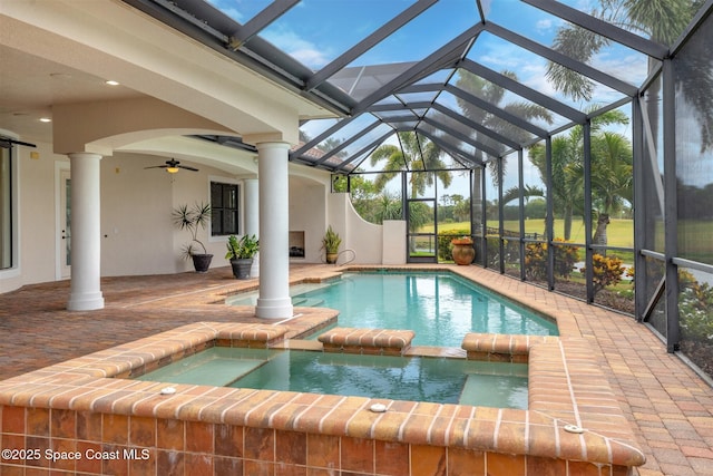 7346 Gorda Peak Ct, Melbourne, FL 32940 - view of pool with a patio, a ceiling fan, a pool with connected hot tub, and a lanai